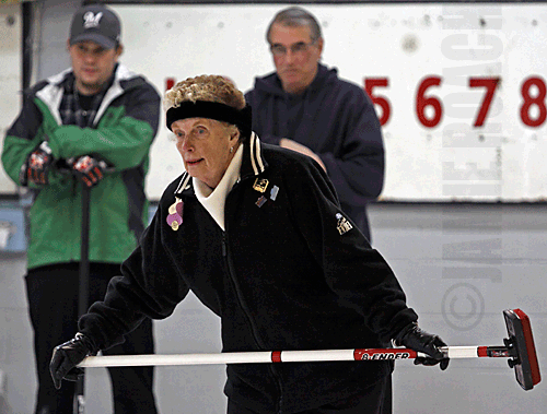Beth Couillard, with Andrew Wallace and Paul Ferro in background; 2011 curling closing