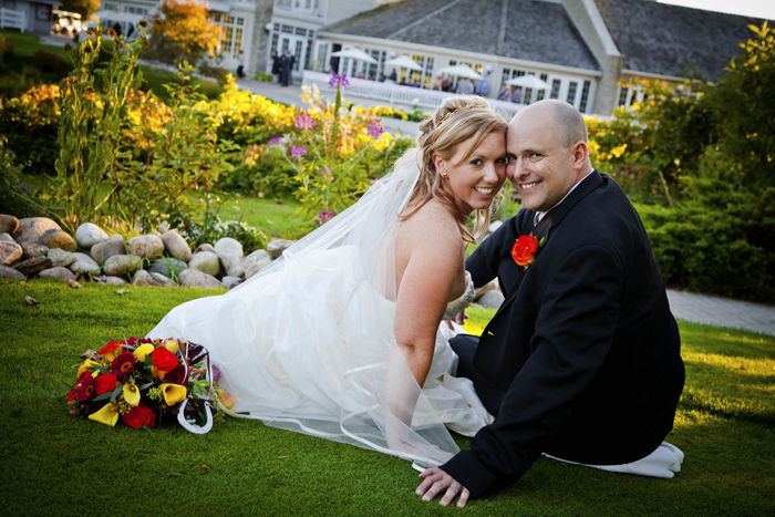 Bride and groom against clubhouse
